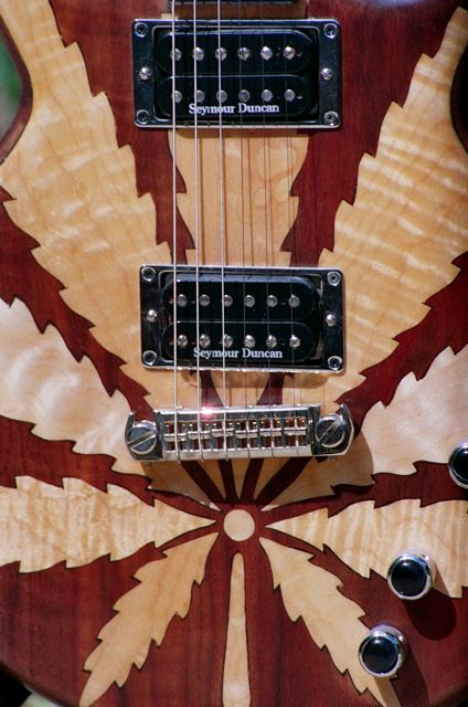 figured maple leaf inlay walnut body electric guitar