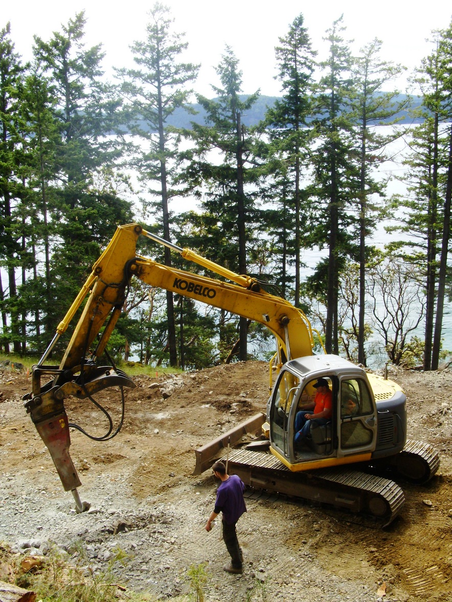 Rock Hammer leveling house site.