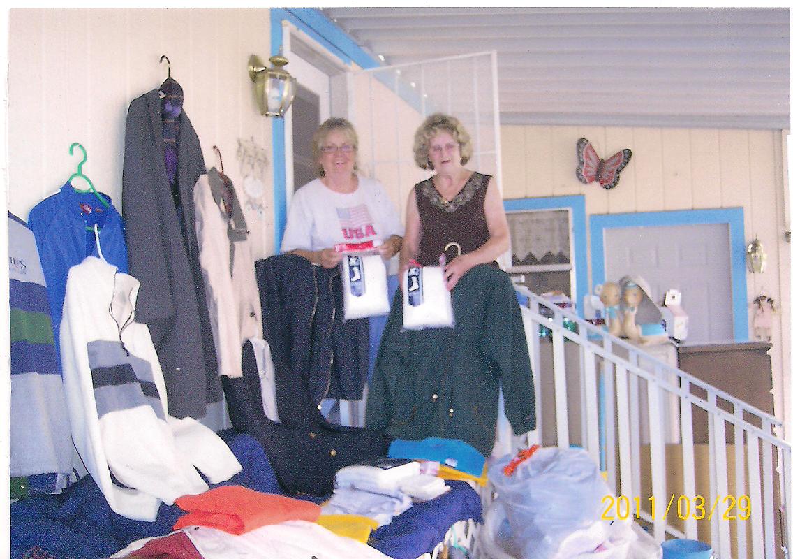 Rita and Deede sorting the clothing