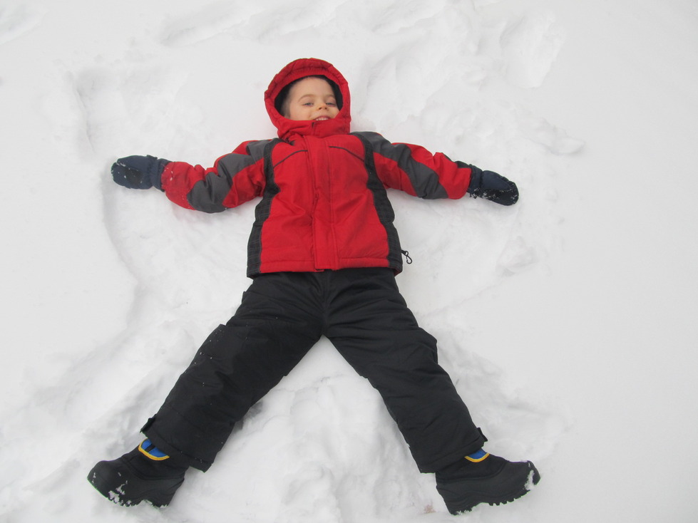 Lucas makes a snow Angel